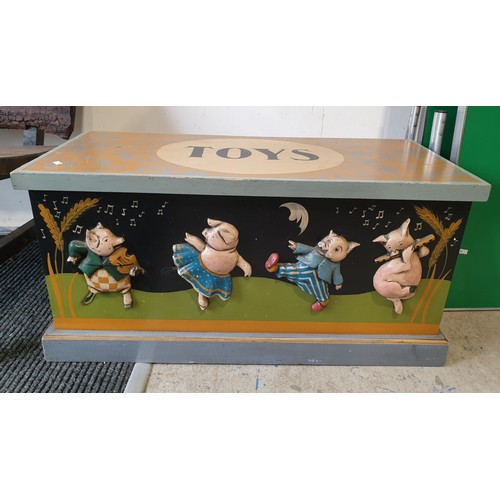 247 - A toy box with applied pig decoration, width 35