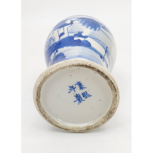 273 - A Kangxi blue and white porcelain vase decorated with fishermen, mark to the base, height 6.75