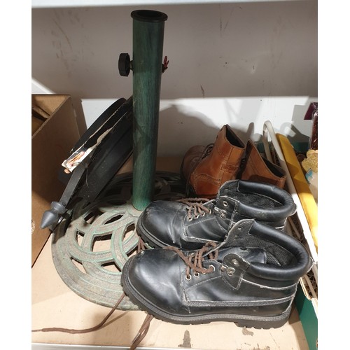 383 - A cast iron garden parasol base, an outdoor clock and two pairs of work boots. No shipping. Arrange ... 