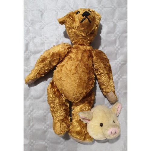 450 - A vintage straw filled articulated teddy bear, length 18