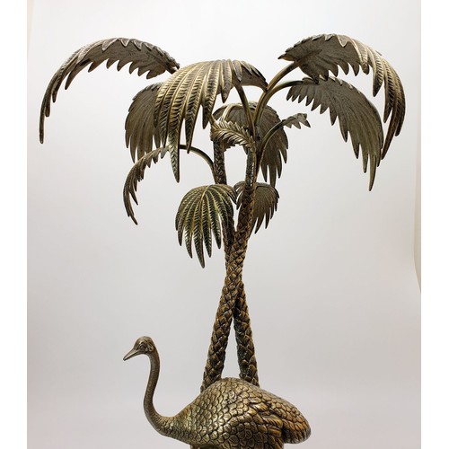 451 - An antique silver plated table centre piece modelled as an Ostrich beside palm trees with a cut glas... 