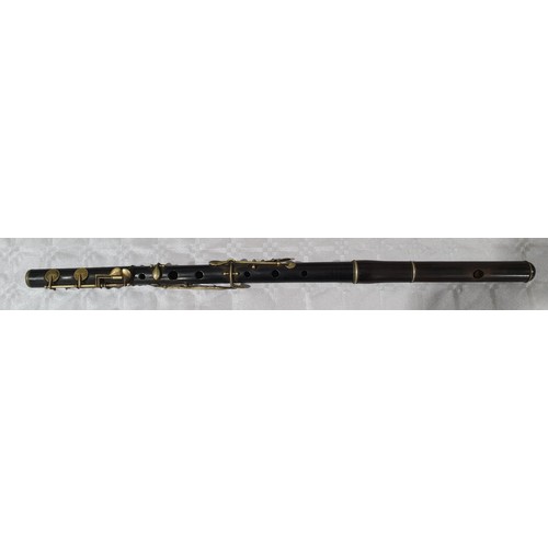 452 - An antique Hawkes & Son of London wooden flute with case and book. UK shipping £14.