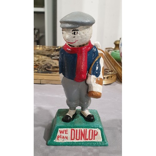 457 - A cast iron Dunlop figure, height 5.75