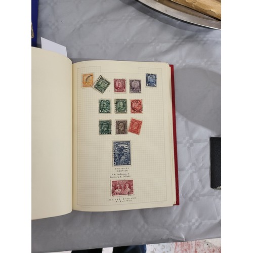 211 - A stamp album containing Penny Reds and one other book containing antique American stamps. UK shippi... 