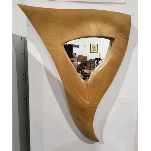 387B - A wooden wall mirror of triangular form, height 21