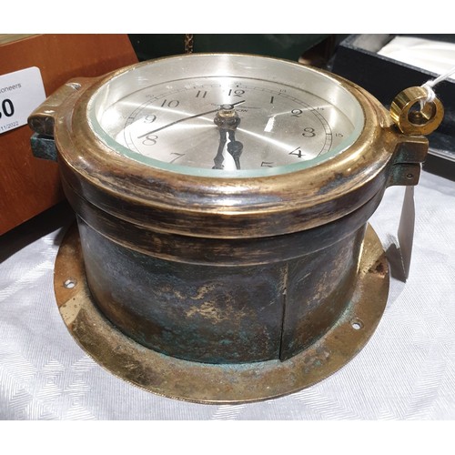 31 - A quartz brass ship's clock, diameter 5.5