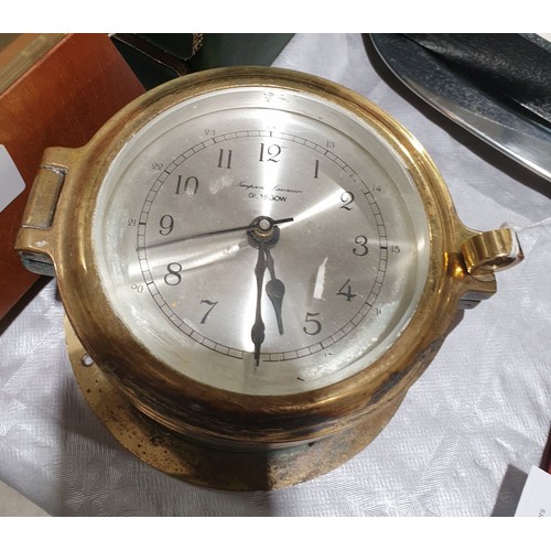 31 - A quartz brass ship's clock, diameter 5.5