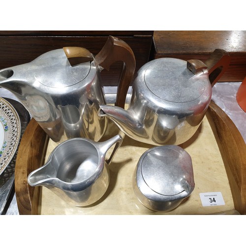 34 - A four piece Picquot ware tea set together with tray. No shipping. Arrange collection or your own pa... 