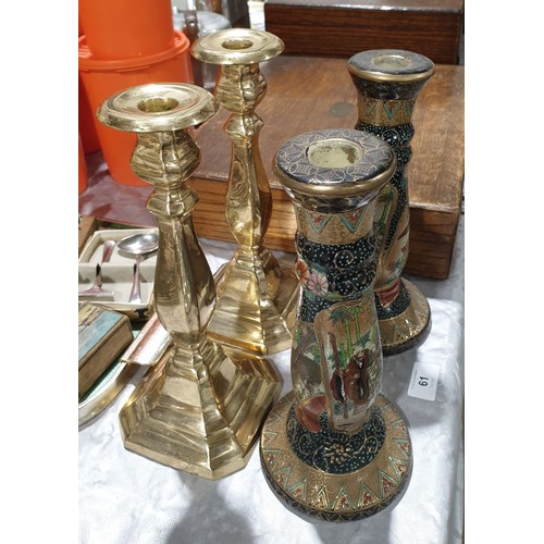 61 - A pair of brass candlesticks, height 10.75