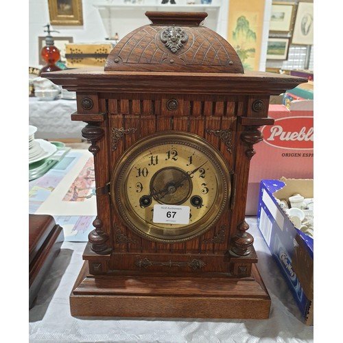 67 - An antique oak mantel clock A/F, height 12.75