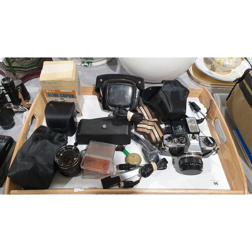 96 - An Olympus OM10 camera together with camera accessories. UK shipping £14.