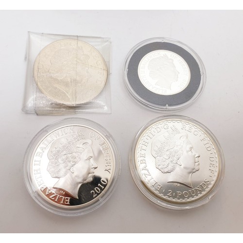 297 - Silver and other proof coins including 2010 1oz silver Britannia. UK shipping £14.