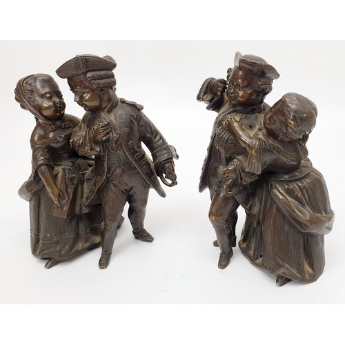 192 - A pair of 19th century bronzes modelled as children dressed in 18th century costume, the tallest 5.2... 