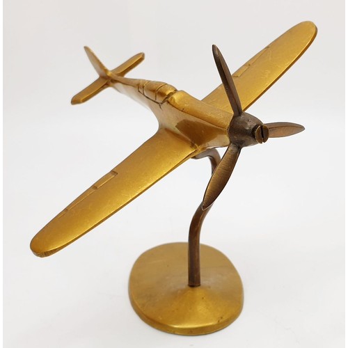 194 - A vintage brass model of a Spitfire, height 5.5