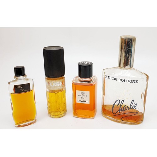 195 - A bottle of Chanel No 5 and other perfumes. UK shipping £14.