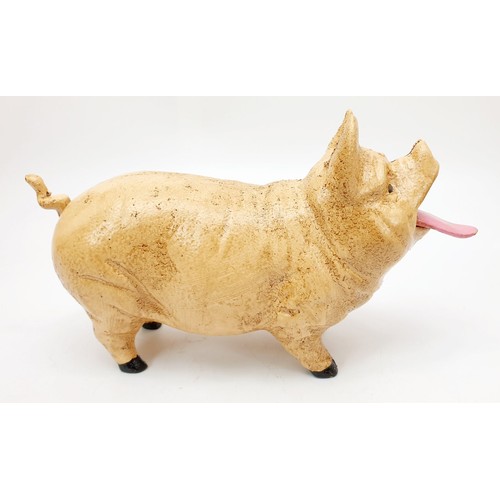 196 - A cast iron money box modelled as a pig, length 8.25