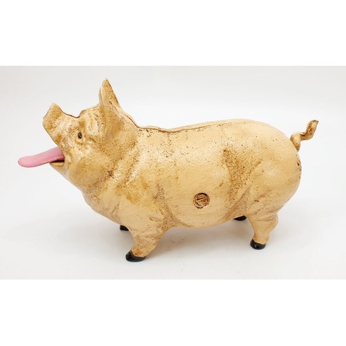 196 - A cast iron money box modelled as a pig, length 8.25