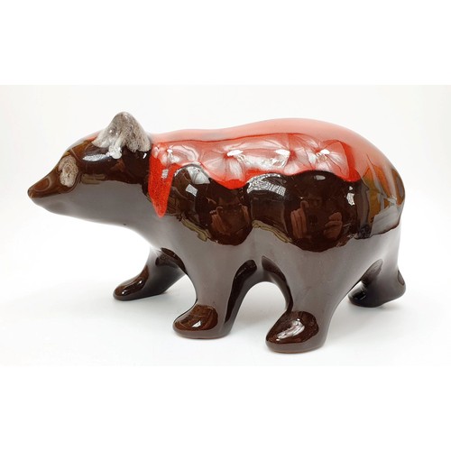 199 - A Canadian Blue Mountain model of a bear finished in red glaze, length 10