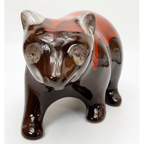 199 - A Canadian Blue Mountain model of a bear finished in red glaze, length 10