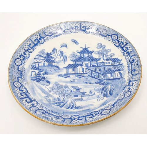 205 - An antique Chinese porcelain dish decorated with pagodas and butterflies, diameter 8.5