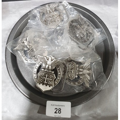 28 - Six new in packet US Air Force belt buckles. UK shipping £14.