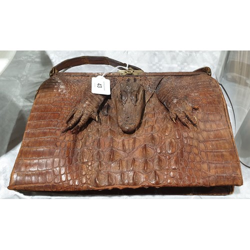 43 - An antique crocodile skin handbag. UK shipping £14.