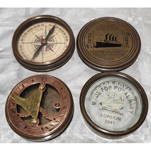 57 - A commemorative Titanic compass together with one other compass. UK shipping £14.