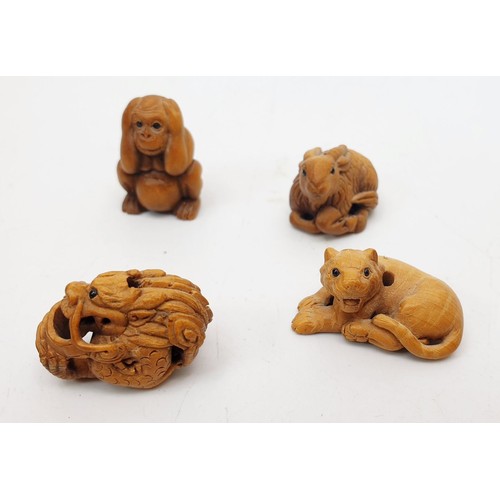 338 - A selection of hard stone and wooden netsuke and a wooden carving, the tallest 2