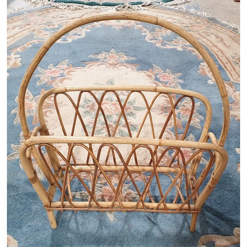 284 - A retro cane work magazine rack. No Shipping. Arrange collection or your own packer and shipper, ple... 