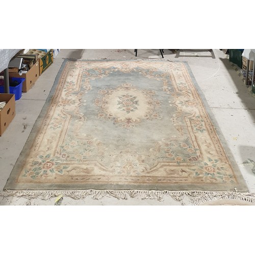 331 - A Chinese oblong woollen rug, 114