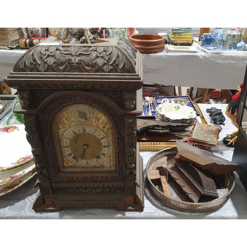 6 - An antique heavily carved oak mantel clock A/F, height 18