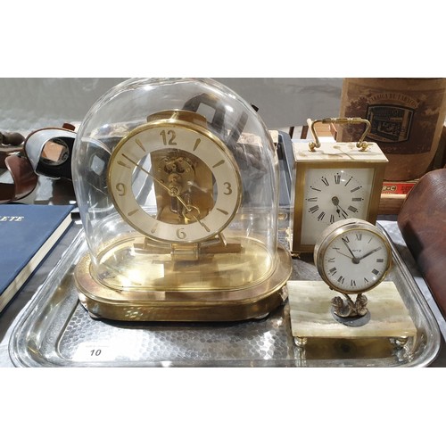 10 - Three vintage clocks: a mantel clock in a glass dome, a carriage clock and a desk clock, the tallest... 