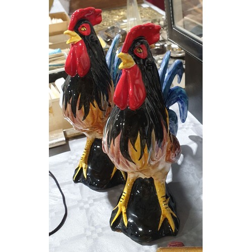 21 - A pair of Toni Raymond Pottery cockerel figures, height 9