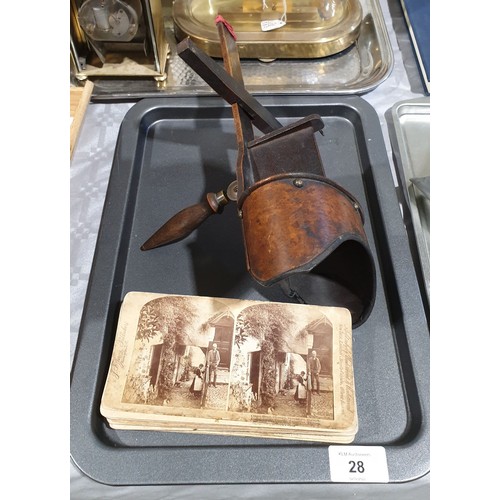 28 - An antique stereoscope with twelve slides. UK shipping £14.