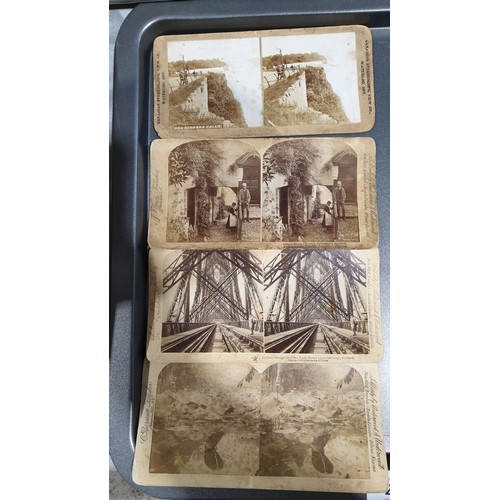 28 - An antique stereoscope with twelve slides. UK shipping £14.