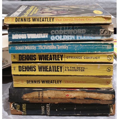 39 - Eight Dennis Wheatley books. UK shipping £14.