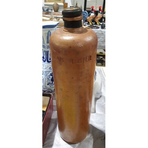 67 - A vintage stoneware Bols bottle, height 12