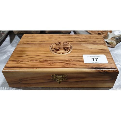 77 - A carved wooden box, width 7