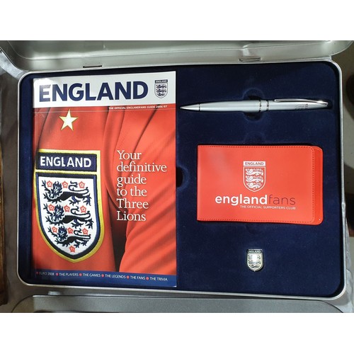 152 - Twelve new in packet England magnetic car flags together with an England fan set. UK shipping £14.