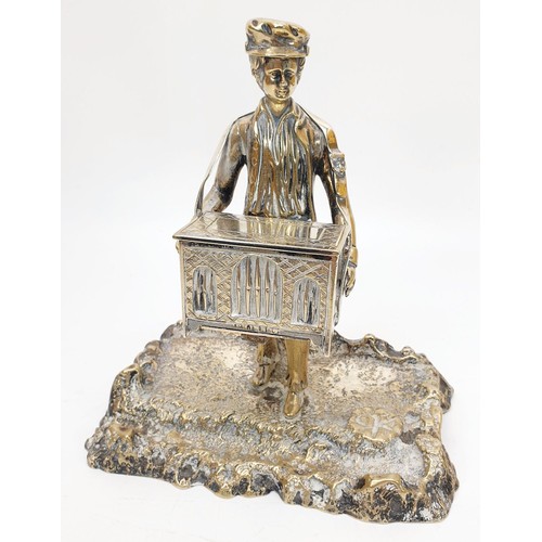 243 - An antique silver plate ink stand in the form of an organ grinder, height 6.75