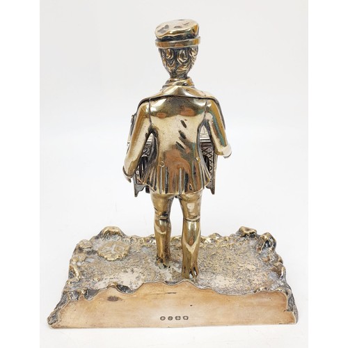 243 - An antique silver plate ink stand in the form of an organ grinder, height 6.75