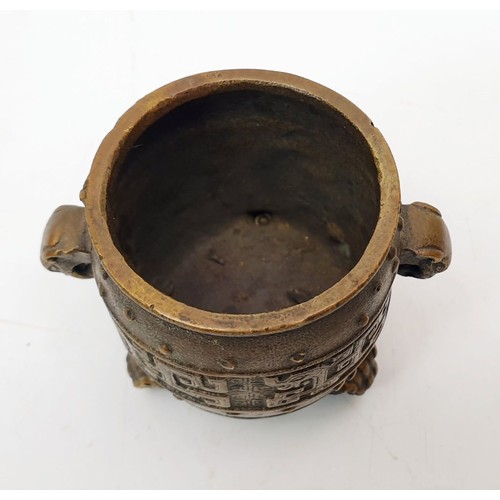 325 - An antique Chinese bronze censor with elephant handles, tripod feet and four character reign mark fo... 