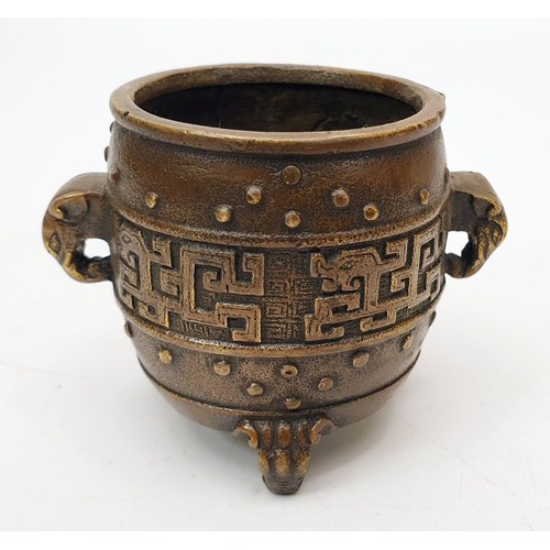 325 - An antique Chinese bronze censor with elephant handles, tripod feet and four character reign mark fo... 