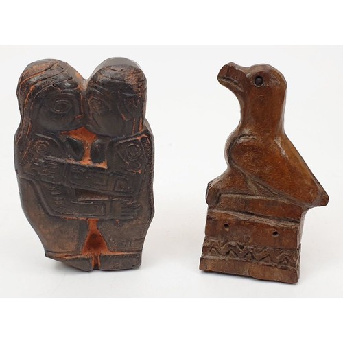 329 - Two Peruvian carvings one in hard stone the other in wood, the longest 2.5