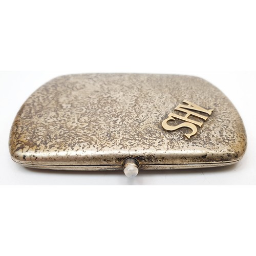 343 - A vintage 800 silver cigarette case with mottled finish and crystal set button initialled A H S, len... 