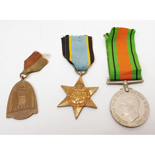 348 - A World War II defence medal, a 1940s Helmond medal and a reproduction Air Crew Europe Star. UK ship... 