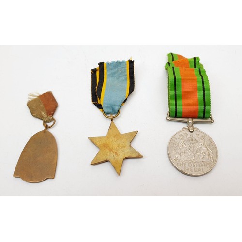 348 - A World War II defence medal, a 1940s Helmond medal and a reproduction Air Crew Europe Star. UK ship... 