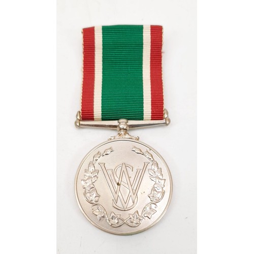 349 - A boxed Women's Voluntary Service medal. UK shipping £14.