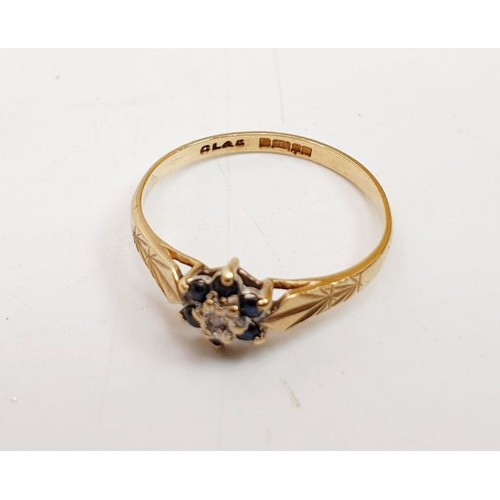 375 - A hallmarked 9ct gold diamond and sapphire cluster ring, size K, weight 0.9g. UK shipping £14.