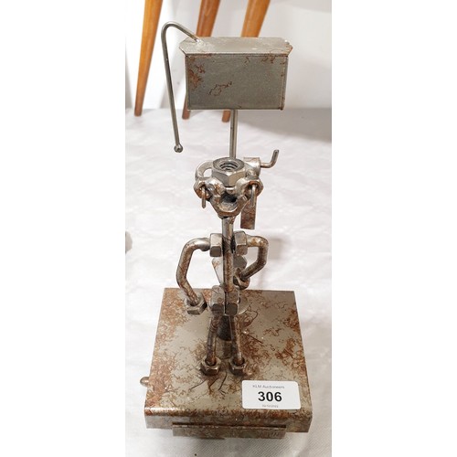 306 - A toilet roll holder sculpture made from nuts and bolts, height 10.75